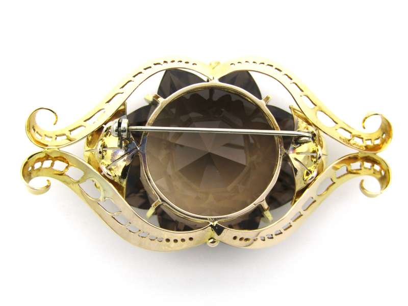 Large 9K gold smoky quartz brooch, circa 1950.