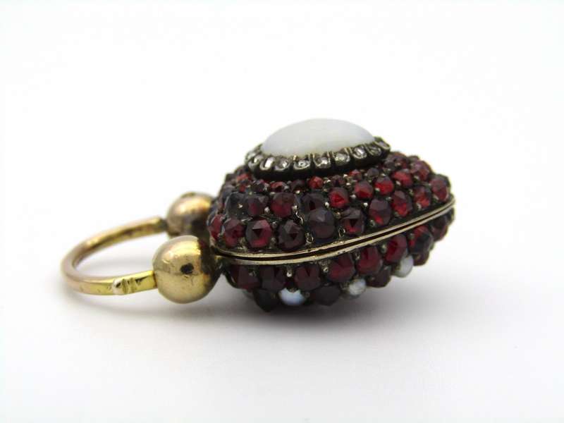 9K gold Victorian opal, garnet, seed pearl, and diamond locket and padlock clasp, circa 1850's.