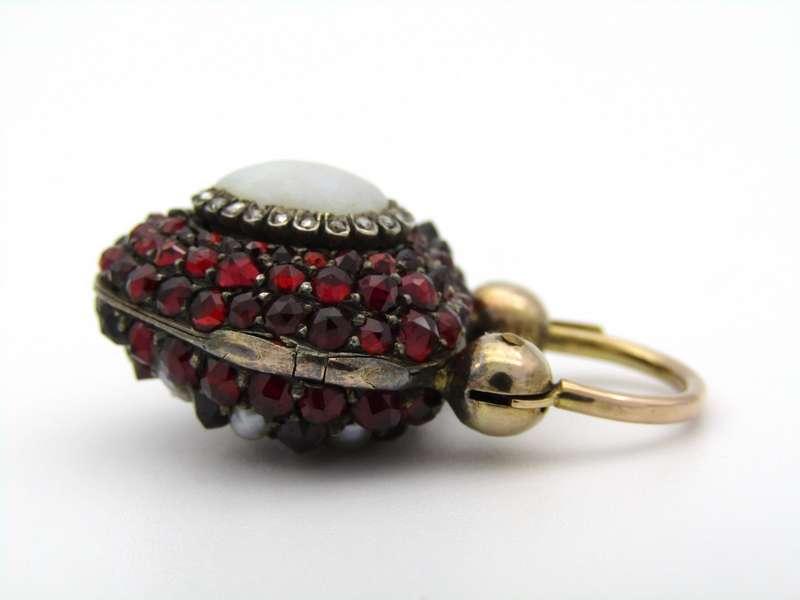9K gold Victorian opal, garnet, seed pearl, and diamond locket and padlock clasp, circa 1850's.