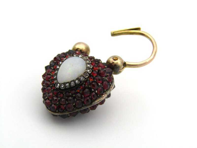 9K gold Victorian opal, garnet, seed pearl, and diamond locket and padlock clasp, circa 1850's.