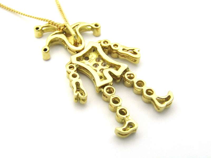 18K gold articulated diamond "Jester" pendant, circa 1980.