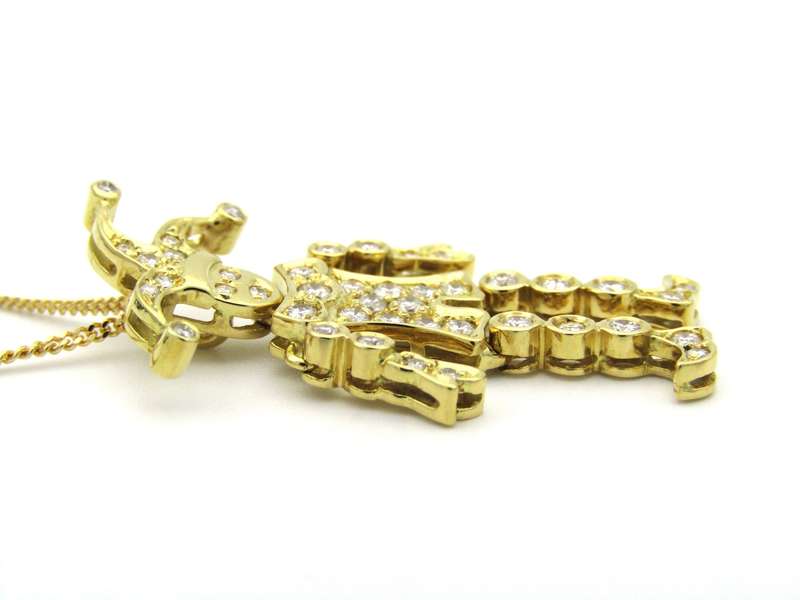 18K gold articulated diamond "Jester" pendant, circa 1980.