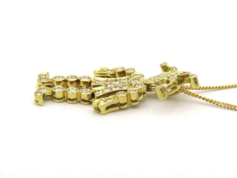 18K gold articulated diamond "Jester" pendant, circa 1980.