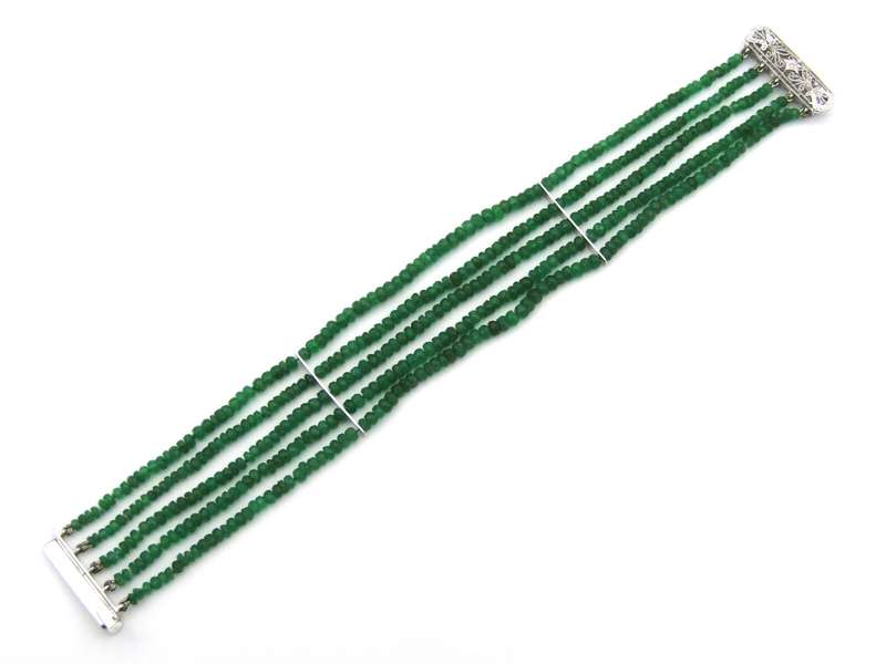 14K gold diamond and 5 strand emerald bracelet.