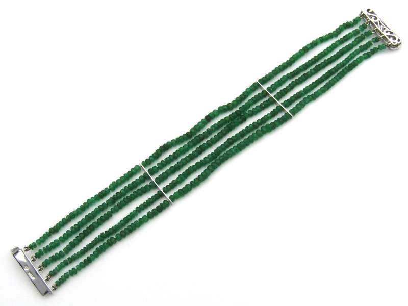 14K gold diamond and 5 strand emerald bracelet.