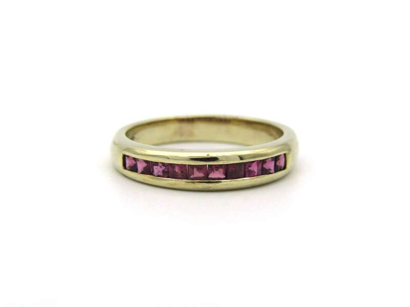 9K gold rhodolite garnet half eternity ring.