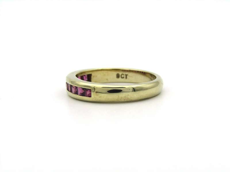 9K gold rhodolite garnet half eternity ring.