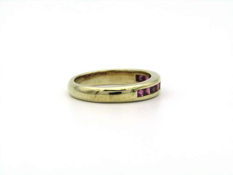 9K gold rhodolite garnet half eternity ring.