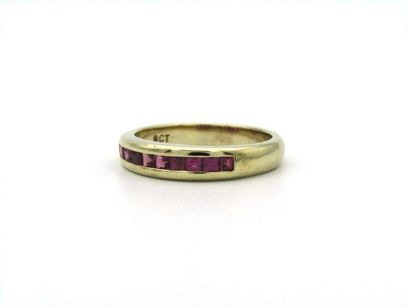9K gold rhodolite garnet half eternity ring.