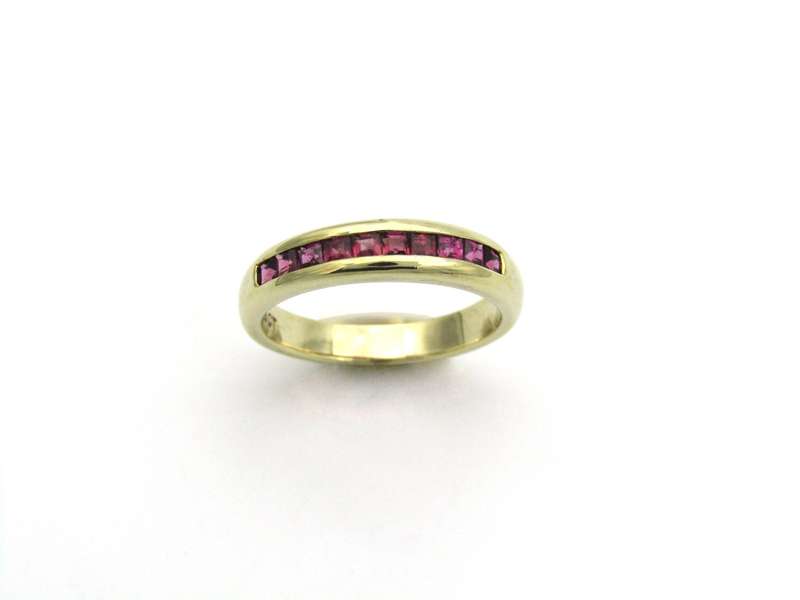 9K gold rhodolite garnet half eternity ring.