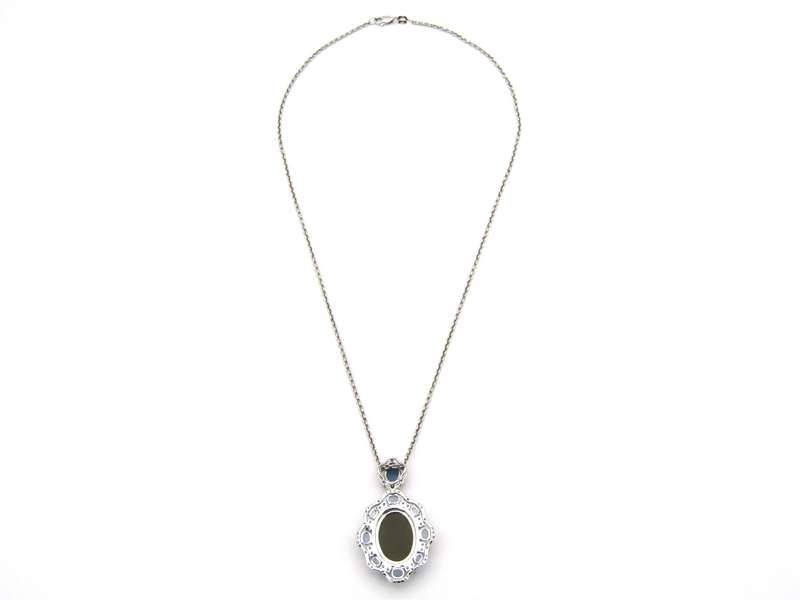 18K gold agate cameo, blue topaz and diamond pendant.