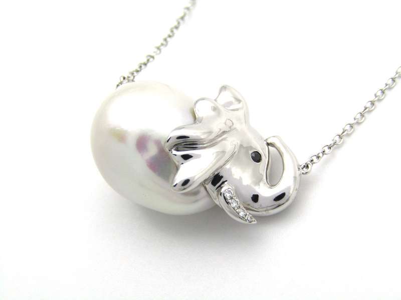 14K gold floating baroque pearl and diamond elephant necklace.