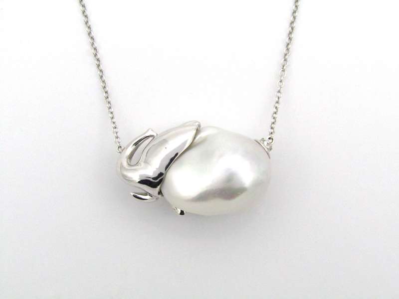 14K gold floating baroque pearl and diamond elephant necklace.