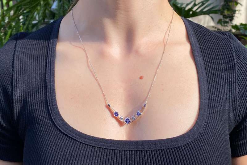 18K gold tanzanite and diamond necklace.