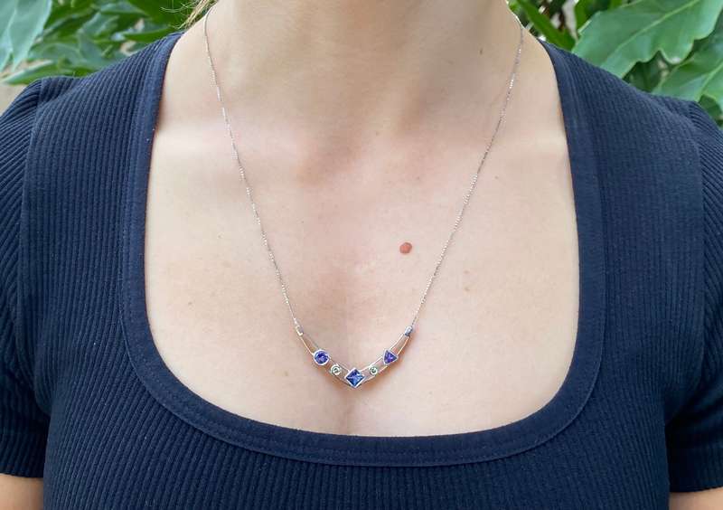 18K gold tanzanite and diamond necklace.