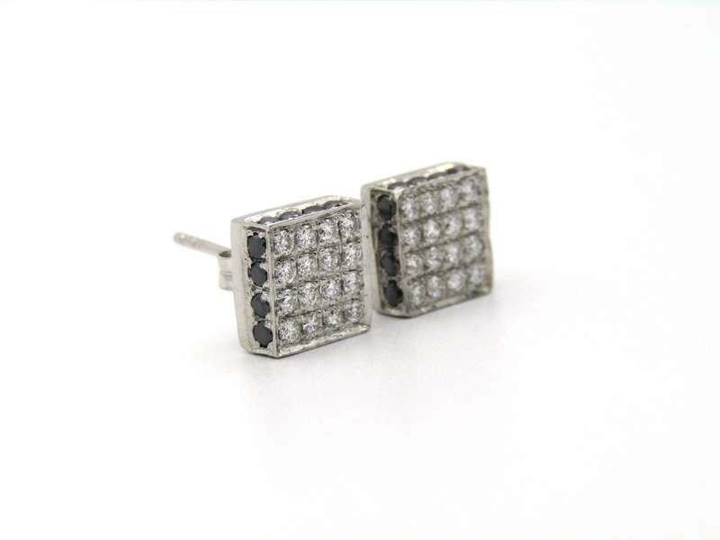 18K gold black and colourless diamond earrings.