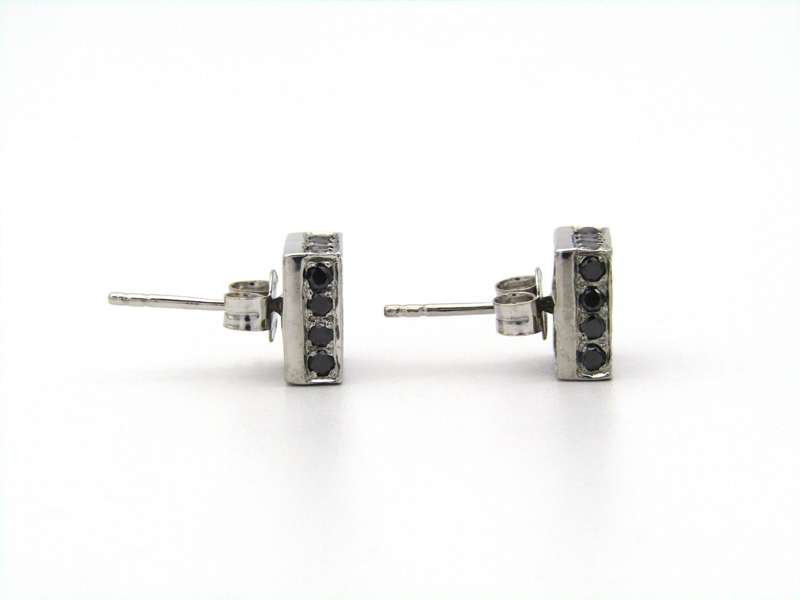 18K gold black and colourless diamond earrings.