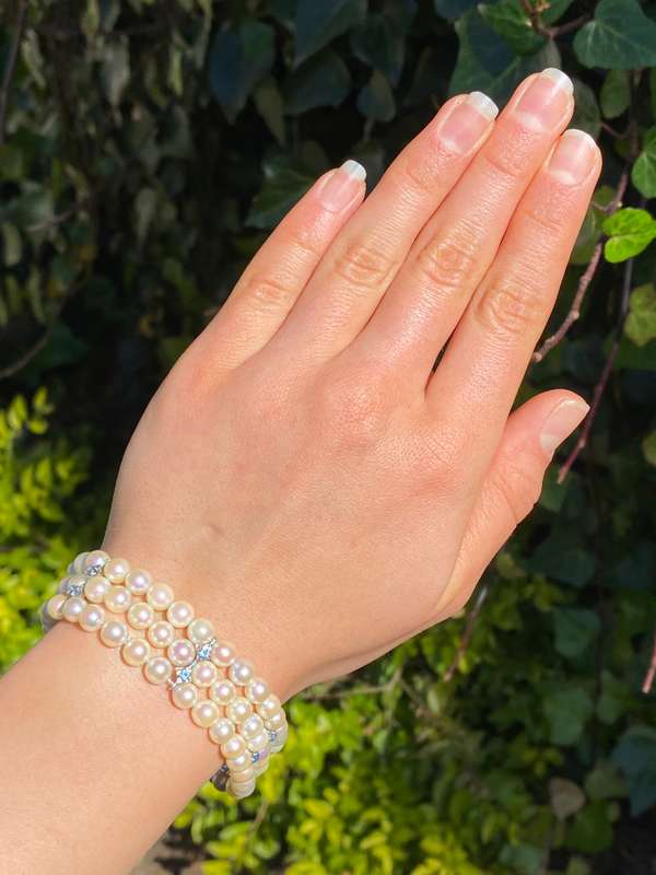 18K gold three-strand akoya cultured pearl bracelet, circa 1980's.