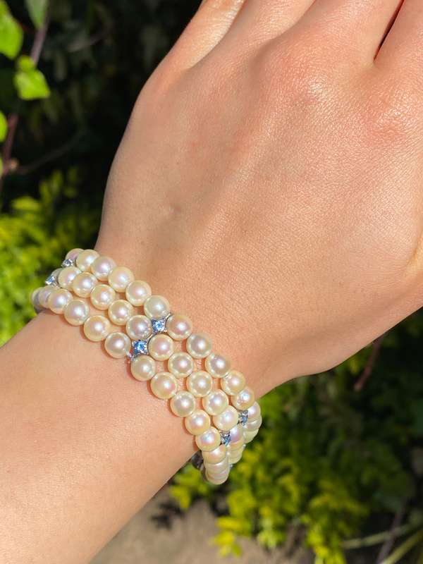 18K gold three-strand akoya cultured pearl bracelet, circa 1980's.