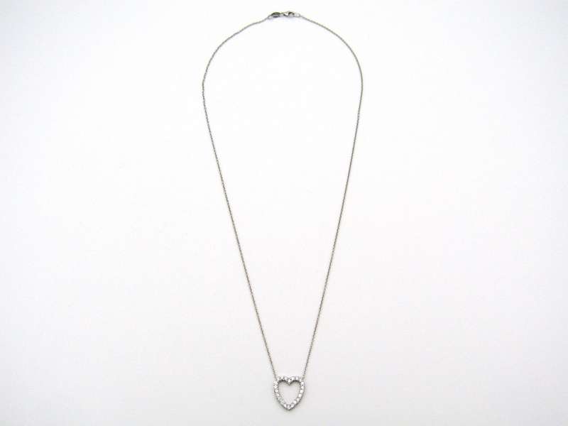 18K gold diamond heart necklace by Browns.