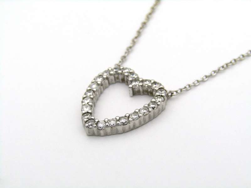 18K gold diamond heart necklace by Browns.
