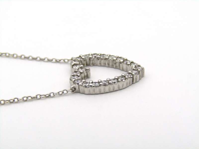 18K gold diamond heart necklace by Browns.