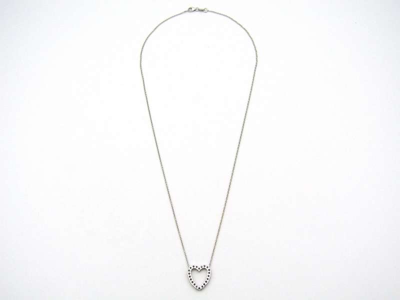 18K gold diamond heart necklace by Browns.