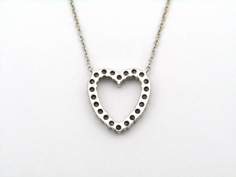 18K gold diamond heart necklace by Browns.