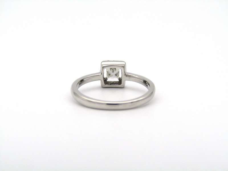 18K gold diamond halo ring.