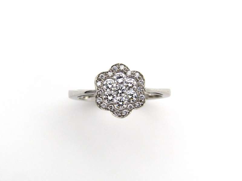 18K gold diamond flower ring.