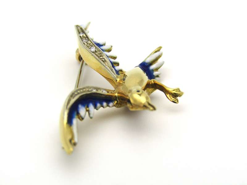 18K gold diamond and enamel "Bird in flight" brooch.