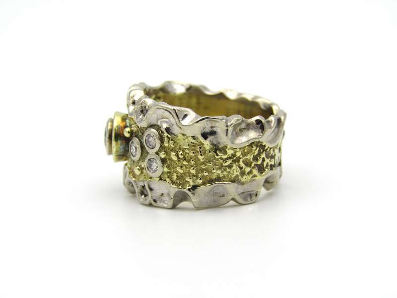 18K gold diamond ring.