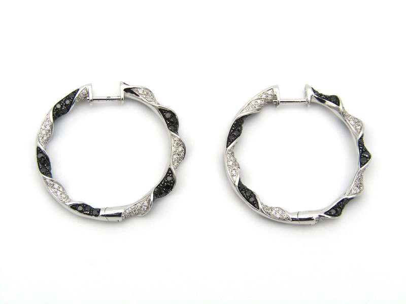 18K gold black and colourless diamond earrings.