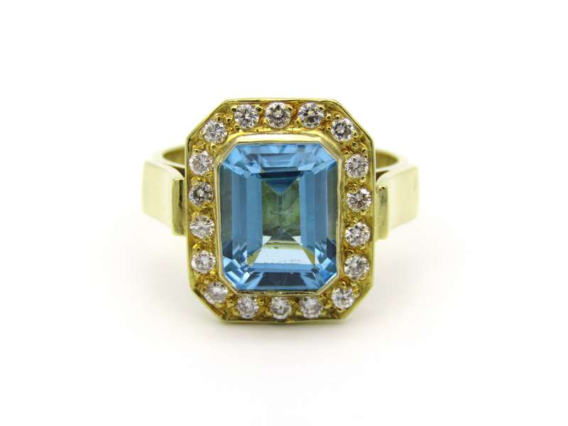 18K gold blue topaz and diamond ring.