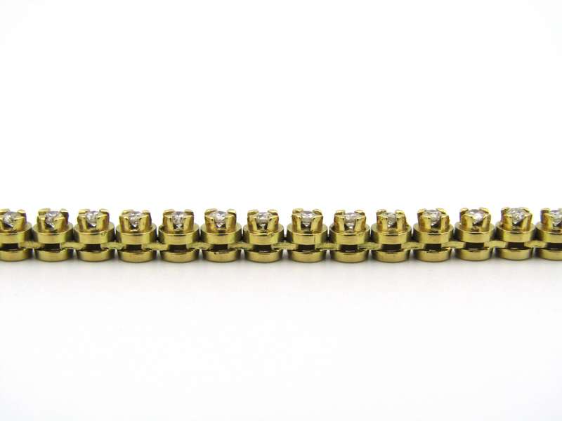 18kt gold diamond tennis bracelet.
