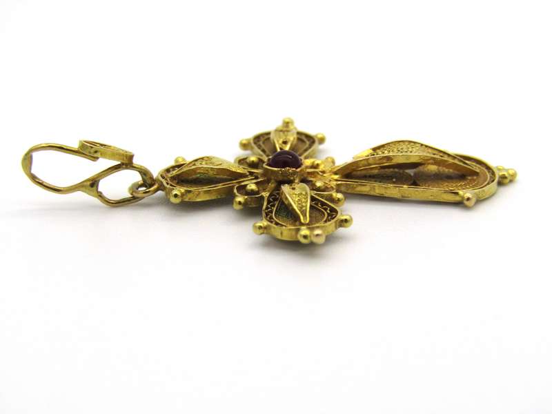 18kt gold filigree ruby cross, Circa 1940.