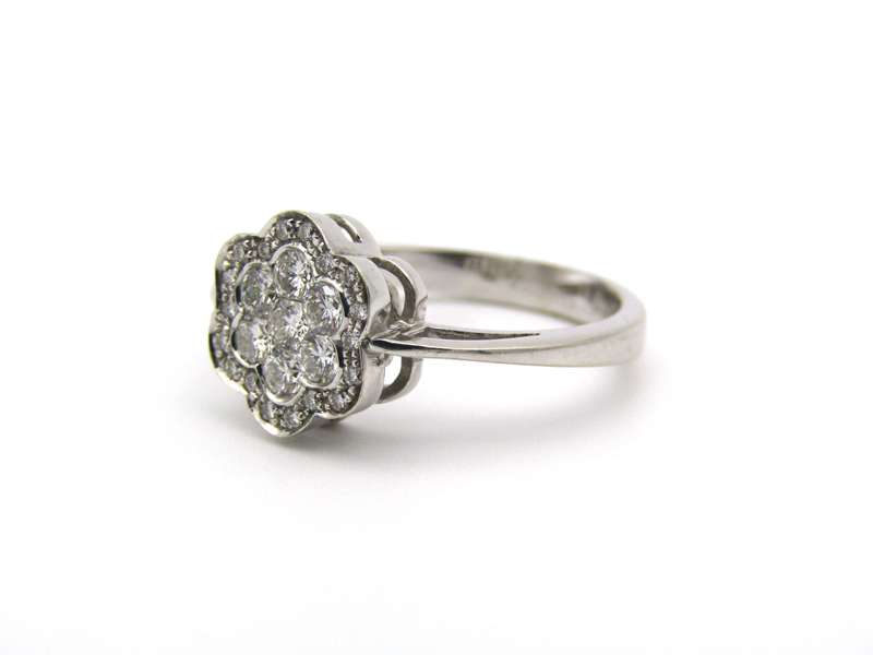 18K gold diamond flower ring.