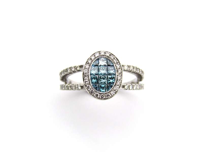 18K gold blue and colourless diamond ring.