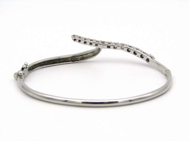 18K gold diamond bangle.