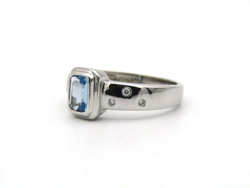 9K gold blue topaz and diamond ring by Browns.