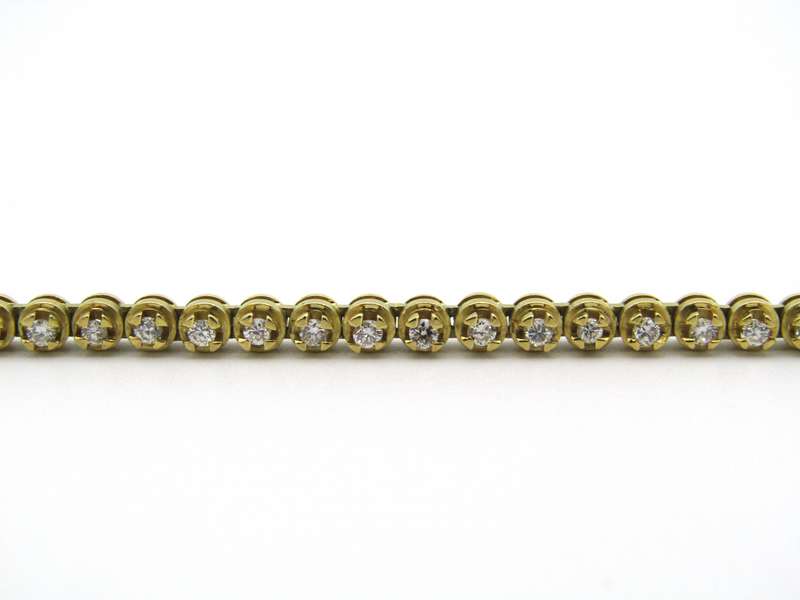 18kt gold diamond tennis bracelet.