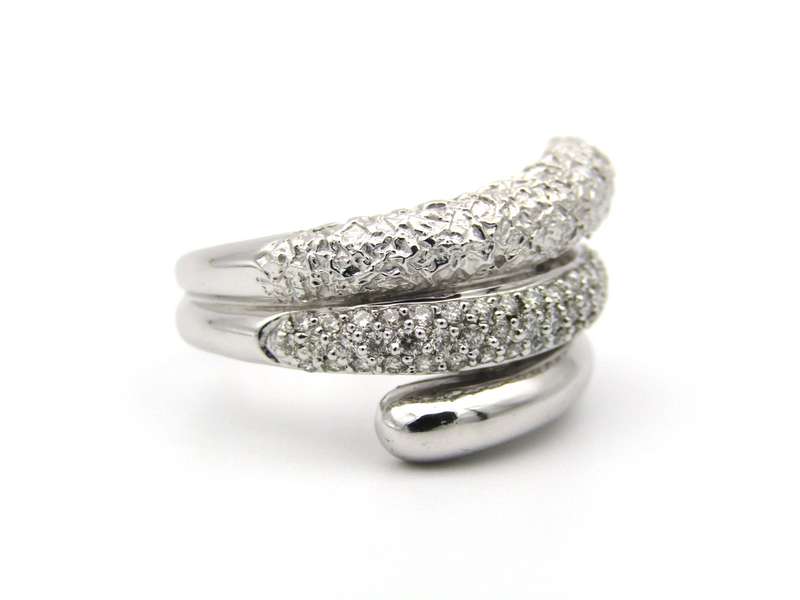 9K gold diamond swirl ring.