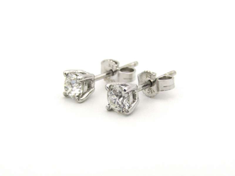 A pair of 18K gold diamond studs.