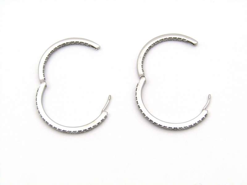 18K gold diamond hoop earrings.
