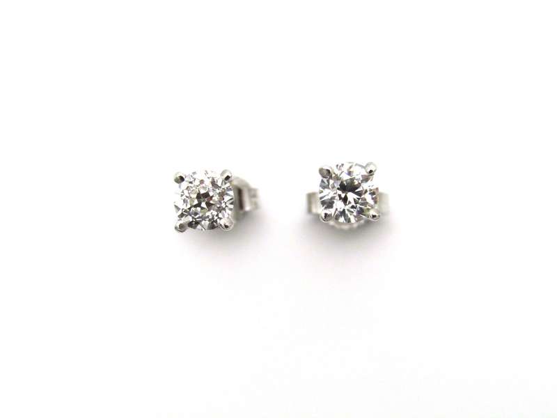 A pair of 18K gold diamond studs.