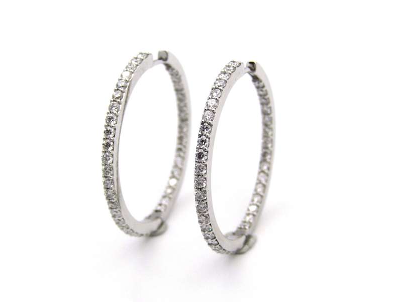 18K gold diamond hoop earrings.