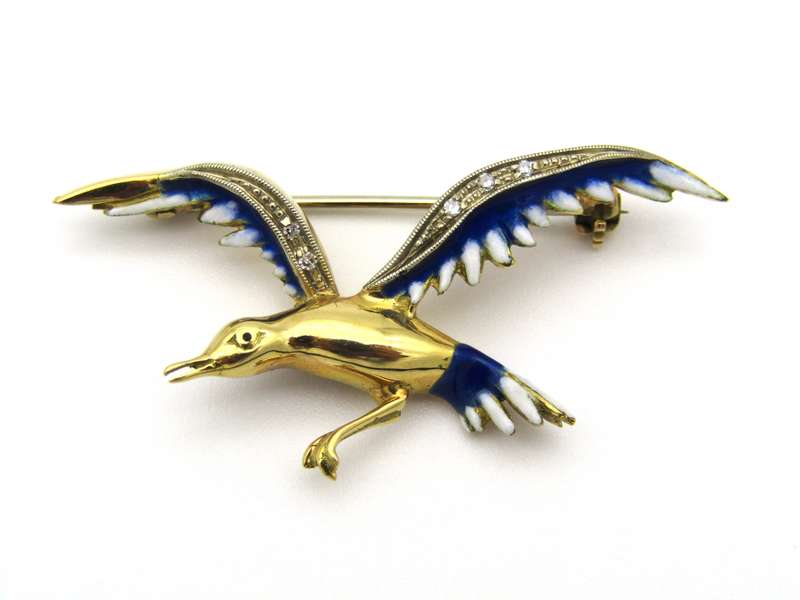 18K gold diamond and enamel "Bird in flight" brooch.