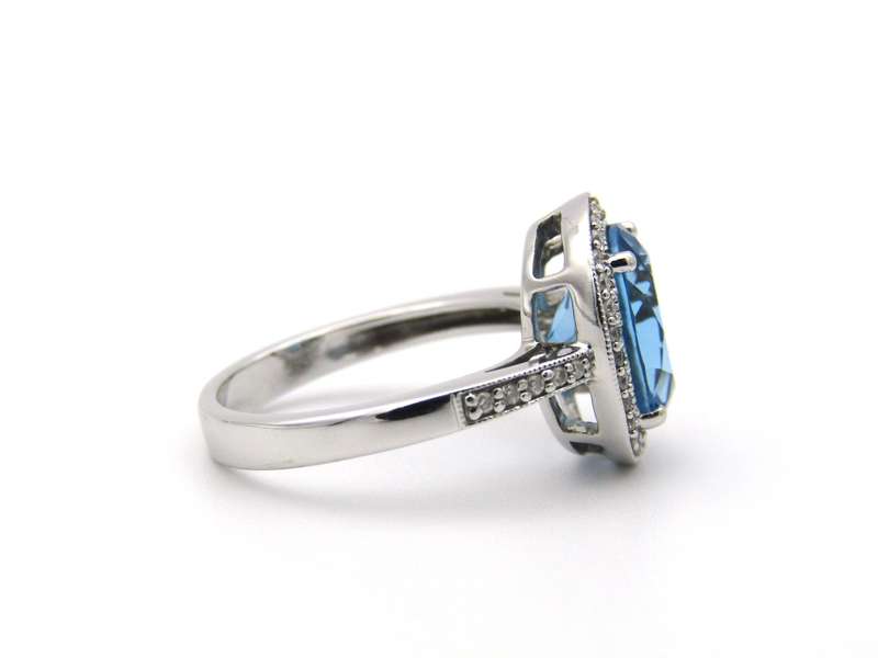 14K gold blue topaz and diamond ring.