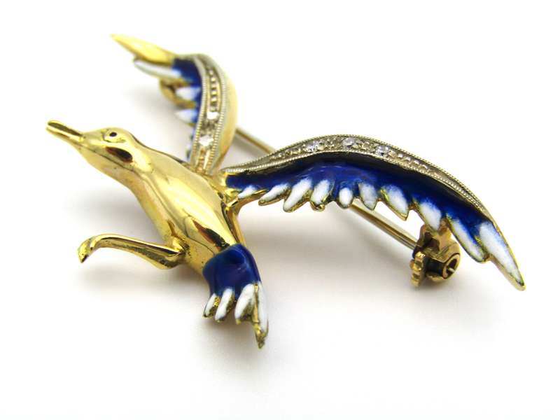 18K gold diamond and enamel "Bird in flight" brooch.