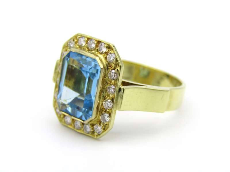 18K gold blue topaz and diamond ring.